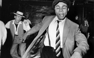 1988-1990 Talking Loud / Dingwalls London, UK A man dancing, wearing a suit, braces and cap © Adam Friedman/PYMCA