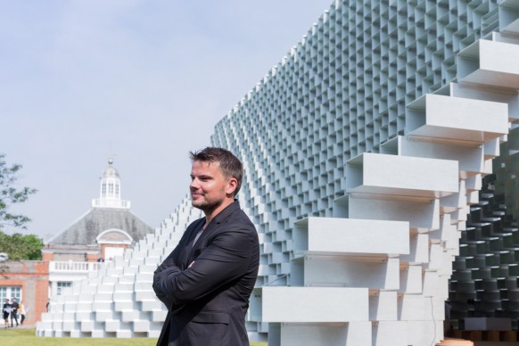 Architect Bjarke Ingels in front of the Serpentine Pavilion 2016 designed by Bjarke Ingels Group (BIG). Photo © Iwan Baan