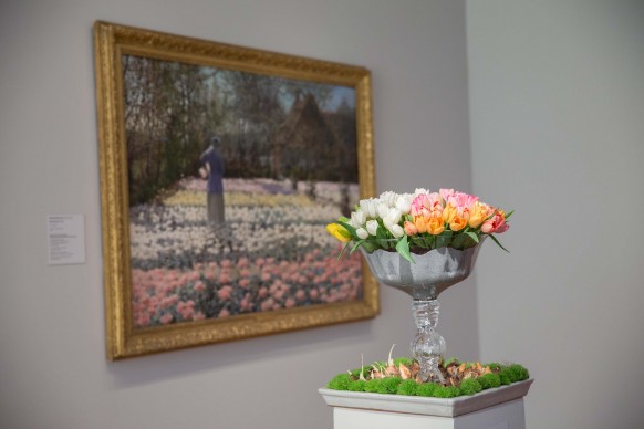 Floral display by Boony Doon Garden Company. Artwork: George Hitchcock, 'Tulip Culture,' 1889. Photograph by Drew Altizer. Image courtesy of the Fine Arts Museums of San Francisco