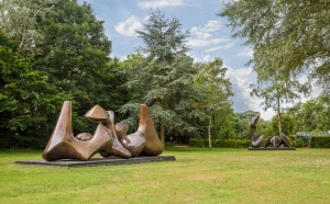 Henry Moore, Three Piece Sculpture, Vertebrae, 1968-69 and Two Piece Recicling Figure, Cut, 1979-81, on display in the gorunds, ph. Sarah Mercer, courtesy Henry Moore Foundation