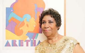 Aretha Franklin with her portrait. Courtesy Angela Pham BFA