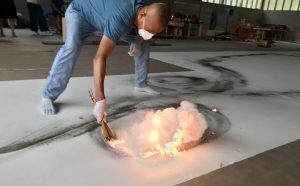 Cai Guo-Qiang during the creation of Color Gunpowder Drawing for City of Flowers in the Sky: Daytime Explosion Event for Florence , 2018 - Photo by Sang Luo, courtesy Cai Studio