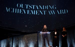 LONDON, ENGLAND - DECEMBER 10: (L-R) Miuccia Prada winner of Outstanding Achievement award on stage with Steve McQueen and Uma Thurman during The Fashion Awards 2018 In Partnership With Swarovski at Royal Albert Hall on December 10, 2018 in London, England. (Photo by Joe Maher/BFC/Getty Images)