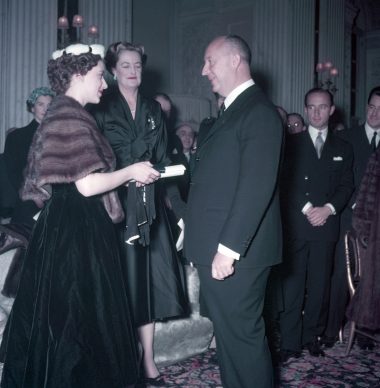 Princess Margaret presents Christian Dior with a scroll entitling him to Honorary Life Membership of the British Red Cross © Popperfoto, Getty Images