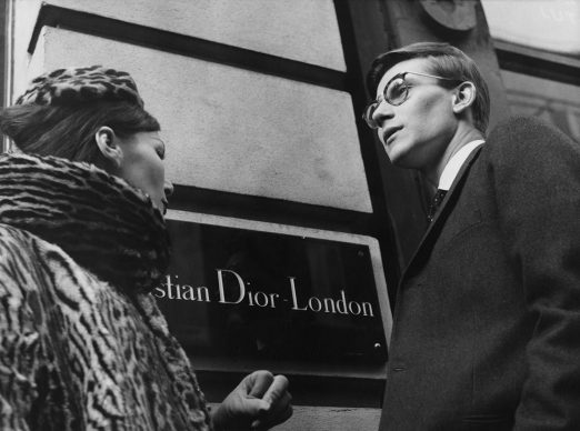 Yves Saint Laurent in front of Christian Dior London, 11th November 1958. © Popperfoto, Getty Images