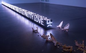 Jenny Holzer Ram , 2016 LED sign with blue, green & red diodes 14 x 762 x 14 cm Text: “Two Faces the Color of Iron” from Building the Barricade by Anna Świrszczyńska, English translation by Piotr Florczyk, © 2016 by Tavern Books. Used with permission of Ludmiła Adamska-Orłowska and the translator. Courtesy the artist and Hauser & Wirth © 2019 Jenny Holzer, member Artists Rights Society (ARS), NY / VEGAP Photo: Collin LaFleche