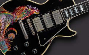 Gibson Guitar Corp. (Kalamazoo, MI); painted by Keith Richards. Les Paul Custom electric guitar (serial no. 7 7277), 1957; painted 1968. Carved mahogany body and neck, ebony fingerboard, 24 3/4 in. scale; black finish with hand-painted design; three patent-applied-for (PAF) humbucking pickups, three-way selector switch, two volume and two tone controls. Collection of Keith Richards