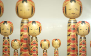 Visitors faces projected on to kokeshi dolls as part of the WOW: City Lights and Woodland Shade exhibition at Japan House London 21 November 2019 - 22 March 2020. Credit: Image by WOW