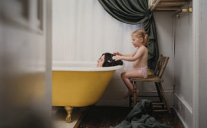 Angela Strassheim, Untitled (Yellow Tub), 2003; chromogenic color print, 29 1/2 x 37 x 1 1/2 in.; National Museum of Women in the Arts, Gift of Heather and Tony Podesta Collection; © Angela Strassheim; Photo by Lee Stalsworth