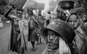 Sebastião Salgado, Water supplies are often far away from the refugee camps. Goma, Zaire. 1994. © Sebastião Salgado Contrasto
