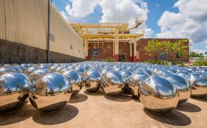 Yayoi Kusama, Narcissus Garden, 1966, stainless steel spheres. Collection of OZ Art. Courtesy of Ota Fine Art and Victoria Miro. © YAYOI KUSAMA. Image courtesy of The Momentary, Bentonville, Arkansas. Photo Ironside Photography