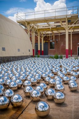 Yayoi Kusama, Narcissus Garden, 1966, stainless steel spheres. Collection of OZ Art. Courtesy of Ota Fine Art and Victoria Miro. © YAYOI KUSAMA. Image courtesy of The Momentary, Bentonville, Arkansas. Photo Ironside Photography