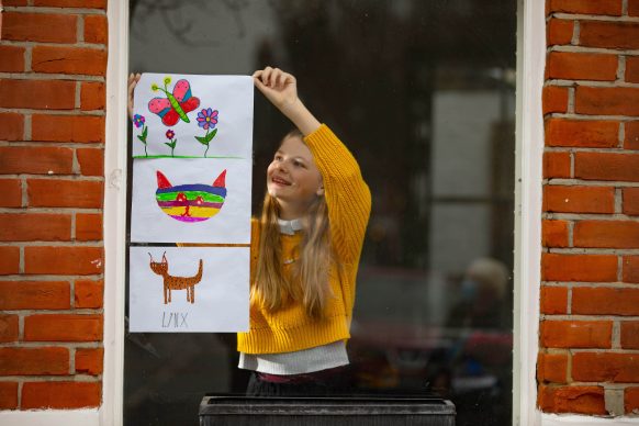 Artwork depicting animals, created by Louie is displayed in the window of a house in Acton, London. Photo David Parry/PA Wire