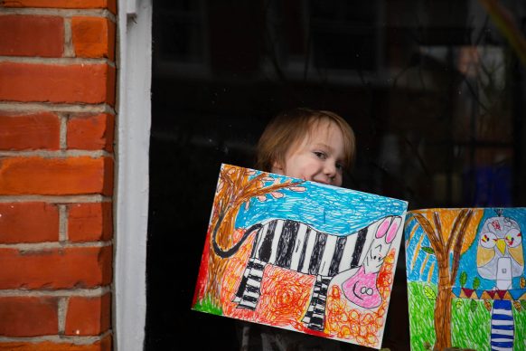 Artwork depicting animals, created by Raymond and Leonard is displayed in the window of a house in Acton, London. Photo David Parry/PA Wire