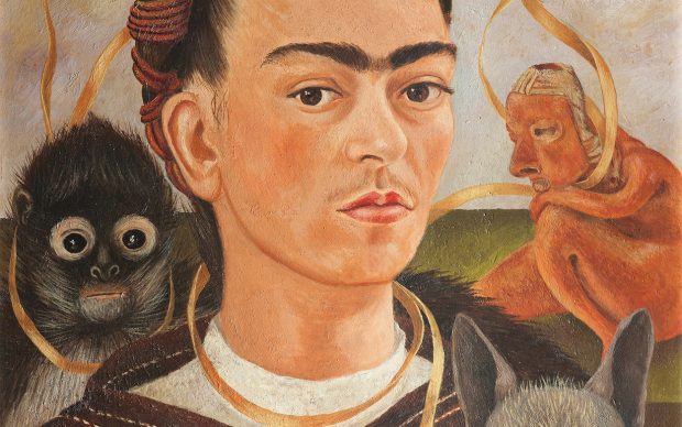 Frida Kahlo, Self-Portrait with Small Monkey. Credit: Frida Kahlo, Self-Portrait with Small Monkey, 1945, oil on masonite, Collection Museo Dolores Olmedo, Xochimilco, Mexico © 2020 Banco de México Diego Rivera Frida Kahlo Museums Trust, Mexico, D.F. / Artists Rights Society (ARS), New York