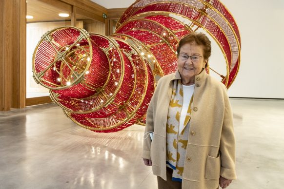 Helga de Alvear portrait, 2021 in front of Descending Light, 2007, Ai Weiwei. Photo: Andy Solé