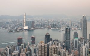 M+ Hong Kong. The M+ building during testing of the LED facade, viewed from Victoria Peak. Photo © Kevin Mak - Courtesy Herzog & de Meuron