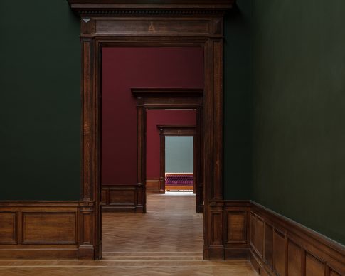 Royal Museum of Fine Arts, Anversa by KAAN Architecten. 19th-century museum - “While visiting the historical museum, guests walk through an enfilade of exhibition rooms tinted in dark pink, green and red” © Stijn Bollaert